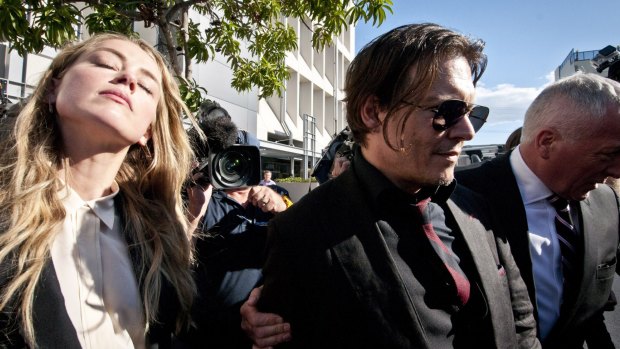 Johnny Depp leaving court with his wife Amber Heard.