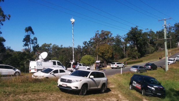 Media wait outside the Gold Coast home.