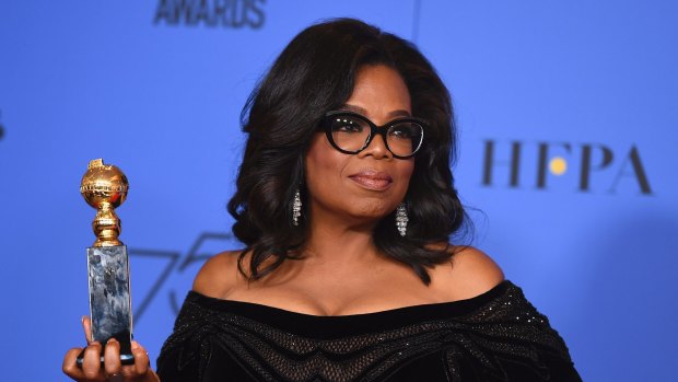 Oprah Winfrey poses in the press room with the Cecil B. DeMille Award at the 75th annual Golden Globe Awards at the Beverly Hilton Hotel on Sunday, Jan. 7, 2018, in Beverly Hills, California.
