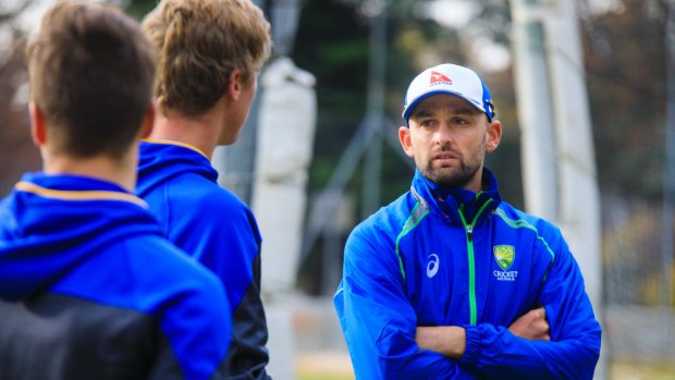 Nathan Lyon gives some advice to Tom Vane-Tempest and Ben Taylor.
