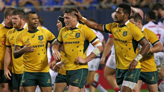 Well done: Sean McMahon is congratulated by teammates after scoring a try against the USA Eagles during the Wallabies' win at Soldier Field in Chicago.