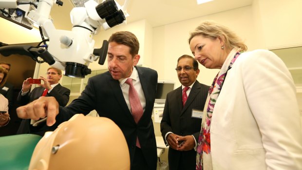 Queensland Health Minister Cameron Dick, UQ dental scientist Sam Samaranayake and Federal Health Minister Sussan Ley on Thursday.