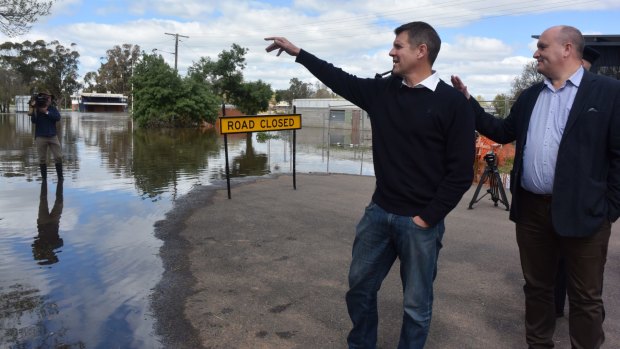 Premier Mike Baird visits flooded Forbes on Monday.