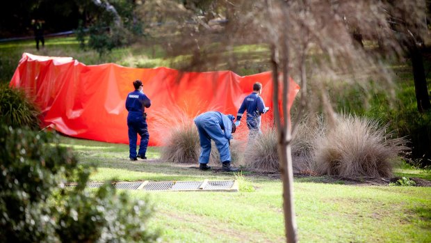Police have erected an orange tarpaulin where the body of a toddler was found in Darebin Creek at 2.45am on April 10, 2016.