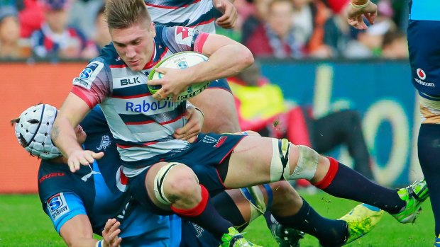 Keeping busy: Sean McMahon in action for the Rebels against the Bulls in June.