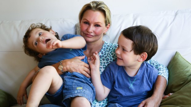 Danica Weeks, whose husband was aboard the missing Malaysia Airlines flight MH370, with their children, Lincoln (right) and Jack.