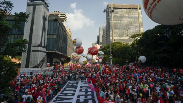 Demonstrators participate in a protest in favour of President Dilma Rousseff and the ruling Workers' Party (PT) in Sao Paulo on March 18.
