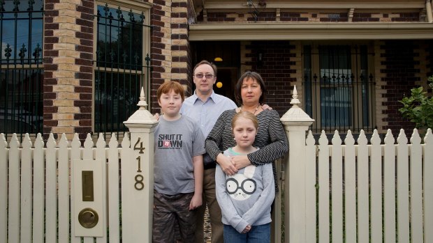Howard and Gillian Tuxworth, with their children Harry and Molly, at the Collingwood home the Victorian government acquired for the East West Link road tunnel. The family has now relocated.
