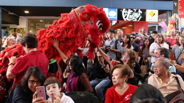 Hundreds of people enjoy the 2016 Chinese New Year Parade and dances at the Chinatown Mall in Fortitude Valley.