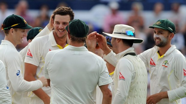 Australia's Josh Hazlewood (second from left) is congratulated on his superb outfield catch to remove England's Stuart Broad late on day three of the first Ashes Test in Cardiff.