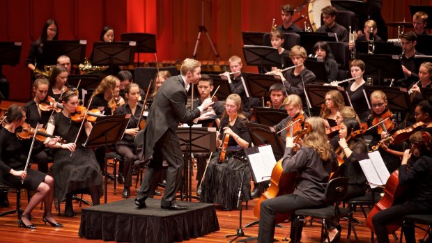 Leonard Weiss, centre, conducts the Canberra Youth Orchestra. Photo: William Hall.