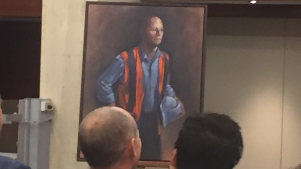 Campbell Newman and wife Lisa look on as the portrait is unveiled.