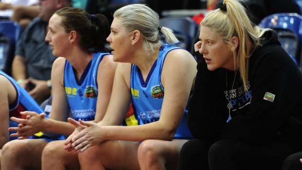 Right, Canberra Capitals player Lauren Jackson looks on from the bench. 
