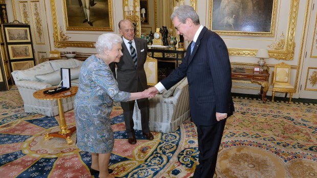 The Queen shakes hands with the Australian High Commissioner Alexander Downer.