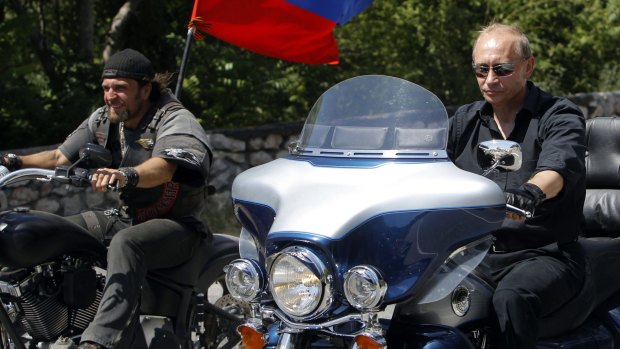 Vladimir Putin (right) rides a Harley Davidson Lehman Trike with Night Wolves leader Aleksandr Zaldostanov, known by the nickname "The Surgeon, in 2010.