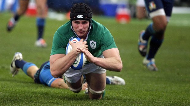 Ireland's Sean O'Brien scores a try against Italy.