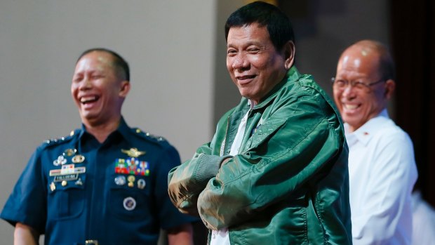 Philippines President Rodrigo Duterte wears a pilot's jacket presented to him during a visit to Air Force headquarters in Pasay, Philippines, earlier this month.