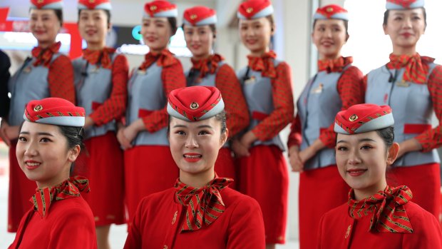 Flight attendants take a group photo at Pingdu city, Shandong Province, China.