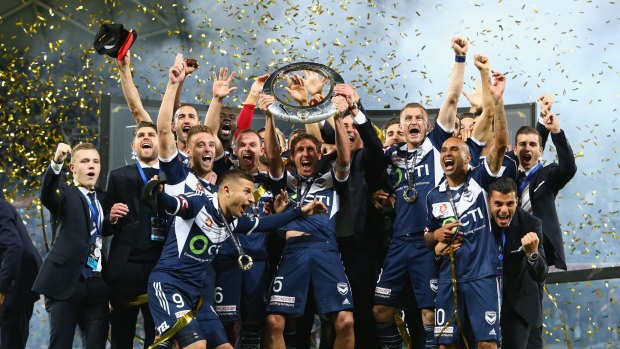 Melbourne Victory, and coach Kevin Muscat, celebrate winning the A-League championship after their 3:0 grand final triumph over Sydney FC.