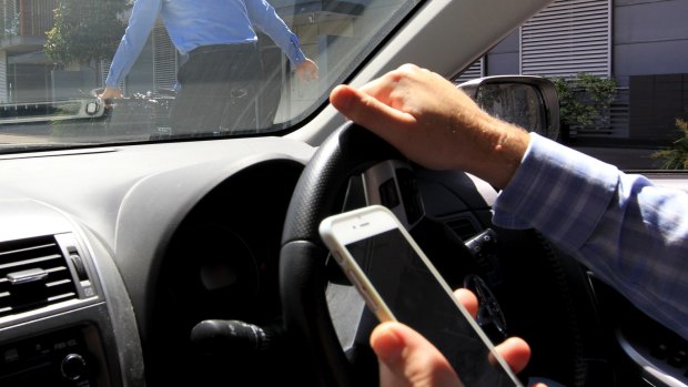 There is a total ban on P-platers using mobile phones behind the wheel.