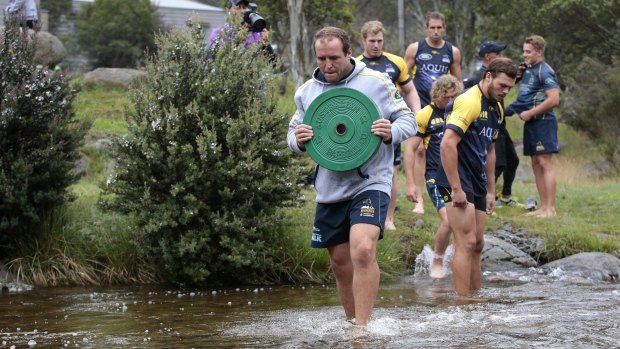 Players had to carry weights across a creek as part of the challenges.