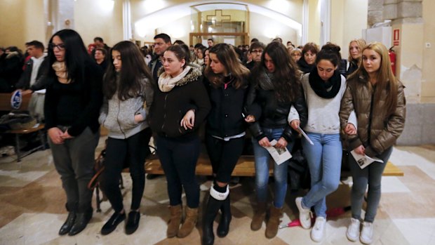 Students at mass in Llinars del Valles, the town where German exchange students lost in the Germanwings crash studied Spanish.