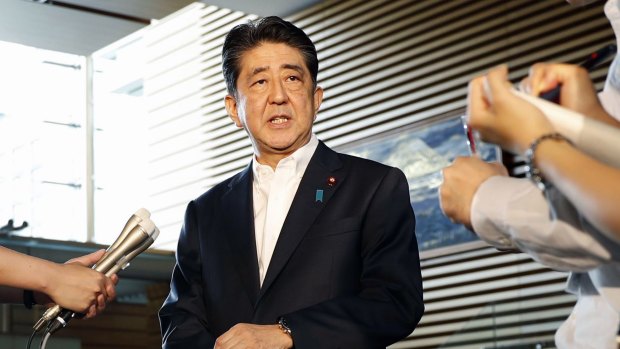 Japanese Prime Minister Shinzo Abe speaks to journalists  after North Korea's firing of a missile over Japan on Tuesday.