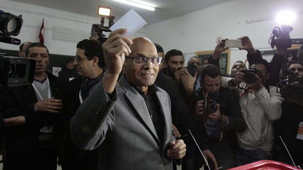 President Moncef Marzouki, who is seeking re-election, casts his vote in Sousse on Sunday.