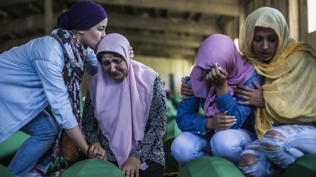 Family members mourn the victims of the 1995 Srebrenica massacre on Friday.