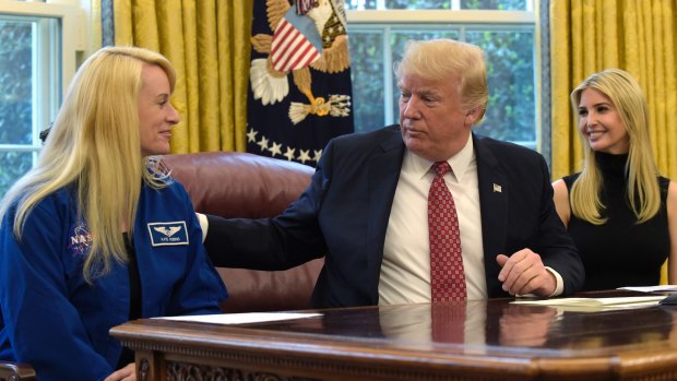President Donald Trump and his daughter Ivanka  talk with NASA astronaut Kate Rubins, following a video conference with the International Space Station.