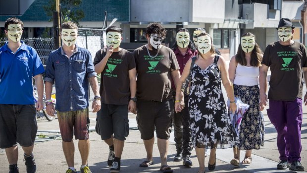 Anonymous activists meet in inner Brisbane wearing Guy Fawkes masks, an item that has been banned during the G20 summit.