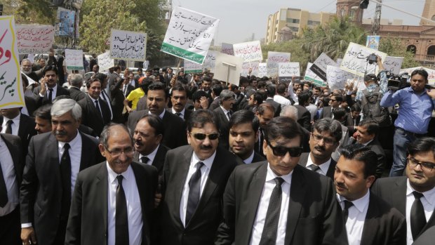 Pakistani lawyers and traders rally to condemn a Sunday suicide attack that targeted Christians gathered for Easter in Pakistan's eastern city of Lahore.