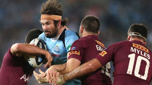 New direction: Blues prop Aaron Woods is tackled during game two of the State of Origin series last year. 