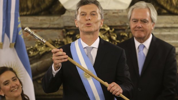 Argentinian President Mauricio Macri holds the presidential baton during his swearing-in ceremony in Buenos Aires in December.