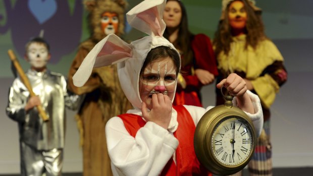 Rabbit, played by Imogen Baggoley, 8, is very late to an important date. She is joined by the Tin Man, left, played by Joss Kent, the Lion (Karissa Nicholson), the Queen of Hearts (Shaylah McClymont) and the Scarecrow (Charlotte Gee). 