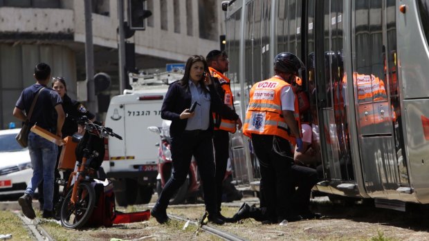 Emergency services at the scene of Friday's stabbing attack in Jerusalem.
