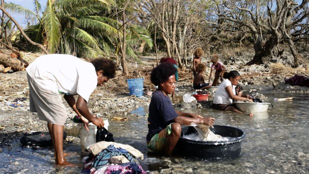 Hard hit region: Women wash clothes on Tanna Island in the southern part of Vanuatu.