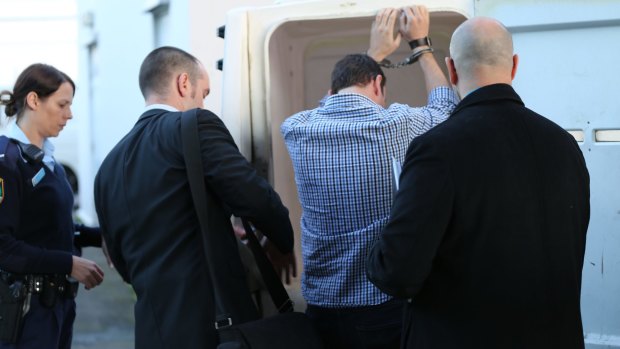 A man is arrested at Sydney Airport in 2014 over the murders.