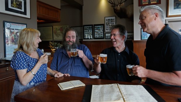 Llewella Bates, Mick Stevens, Stuart McArthur and Tim Dorgan toast the end of their pub crawl at the Clyde Hotel in Carlton on Saturday. 