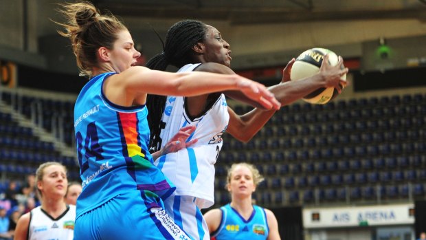 Canberra Capitals' Rosie Fadljevic and South East Queensland Stars' Ify Ibekwe in action. 