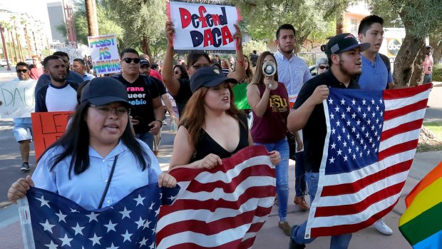 DACA supporters march in protest of the announcement in Phoenix, Arizona.