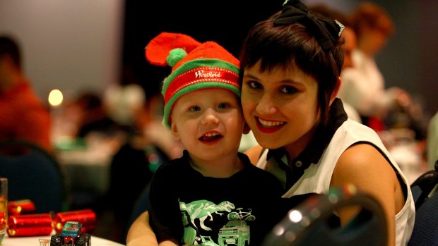 essica Carruthers with stepson Victor Somerville, 2, at the annual Salvation Army Christmas lunch at the Brisbane Convention and Exhibition Centre.