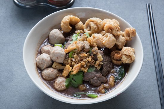 Thai boat noodles with beef and pork crackling.