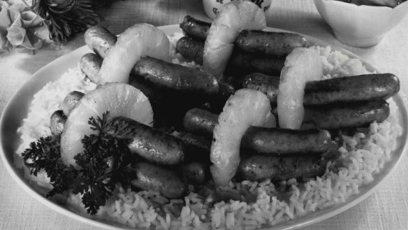 1960s-style "spicy sausages with pineapple and rice" from the Fairfax cookery pages.