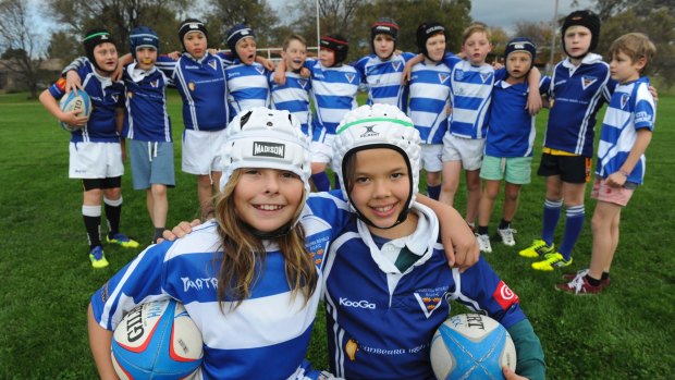 The Royals under-10 rugby union team training at Rivett Oval two years ago with girls Dusty-Rose Bates, left, and Lizzy Marshall.