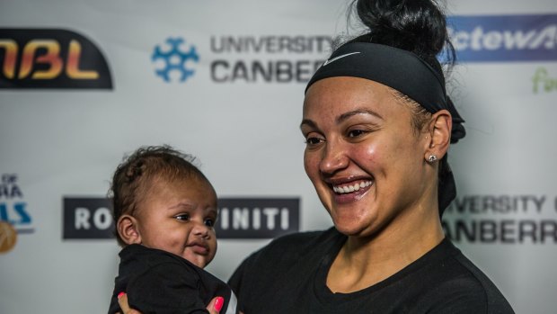 Canberra Capitals recruit Mistie Bass attends her first Capitals press conference with 12 week old son Braven Boyd. 