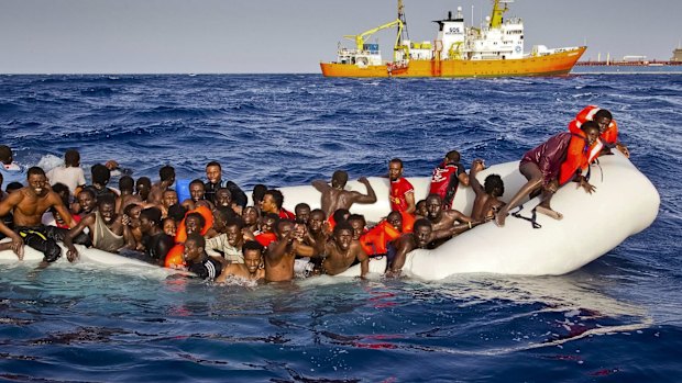 Migrants ask for help from a dinghy in the Mediterranean earlier this month.