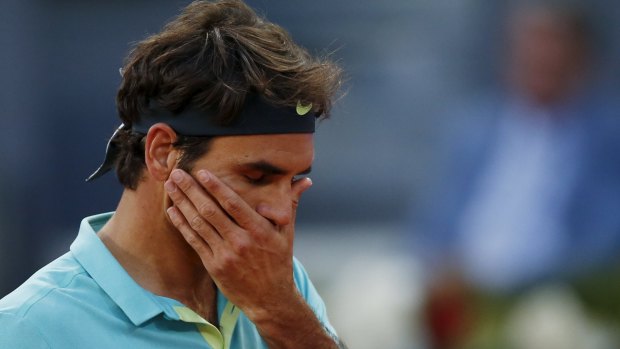 Roger Federer reacts during his match against Nick Kyrgios.