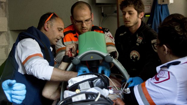 Medics tend to one of the people wounded in a shooting outside a Tel Aviv pub on New Year's Day.