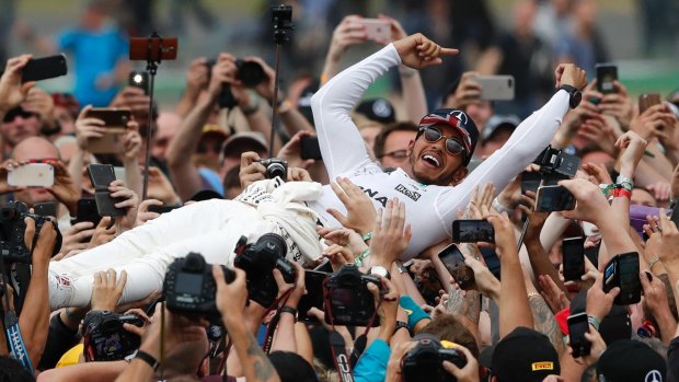 Lewis Hamilton celebrates with home fans at Silverstone.